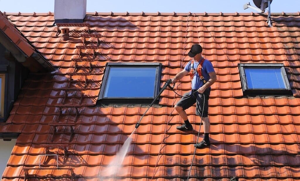 Professional roof pressure washing service by Elegant Styles Power Washing in Naples, Florida, removing moss, algae, and dirt to prevent costly roof repairs.
