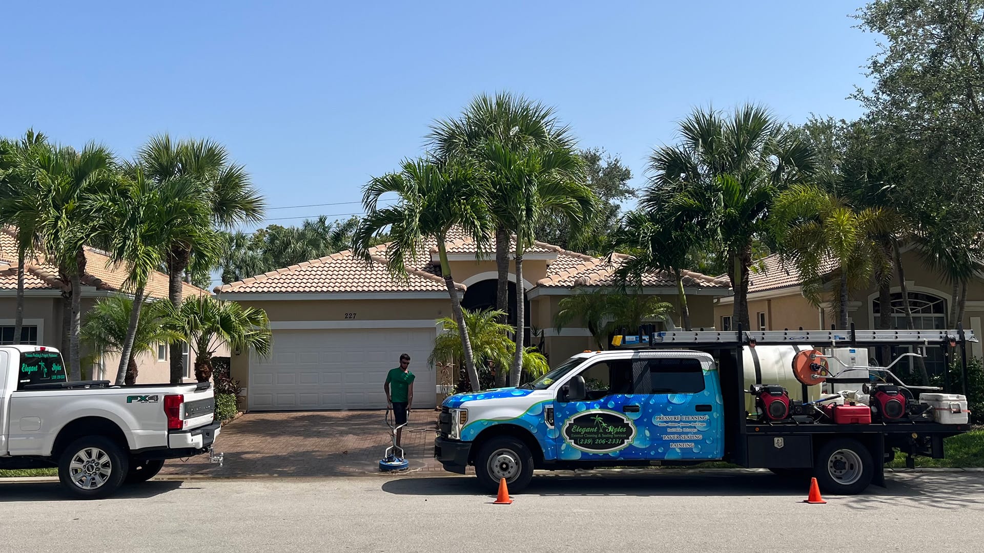 Driveway being professionally pressure washed by Elegant Styles Power Wash in Naples, Florida, restoring cleanliness and safety.
