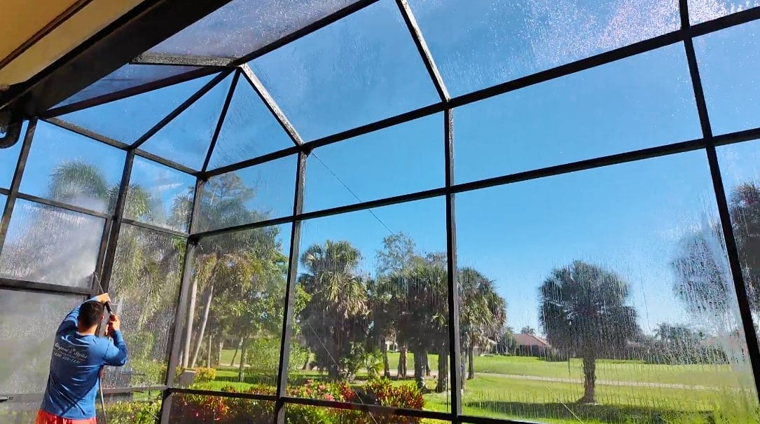 Professional pool cage cleaning service in Naples, FL removing mold and debris by Elegant Styles Power Wash.