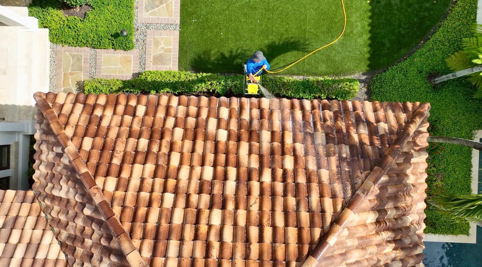 soft roof cleaning service in Naples FL removing algae and protecting shingles.