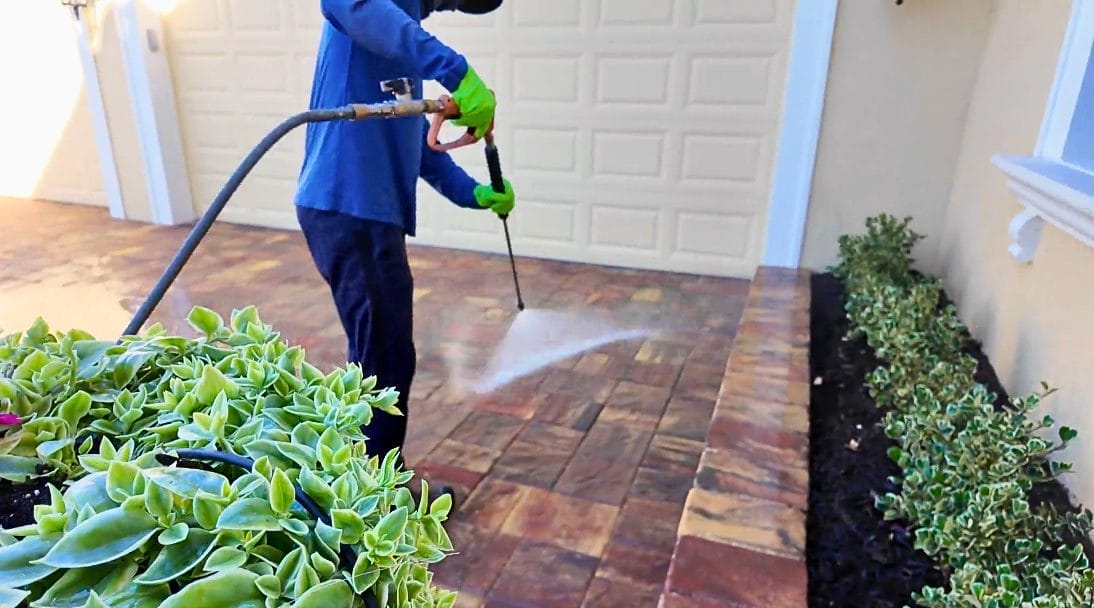 Sustainable walkway cleaning in Naples, FL using eco-friendly pressure washing techniques to safely remove dirt, mold, and algae while protecting plants and surfaces.