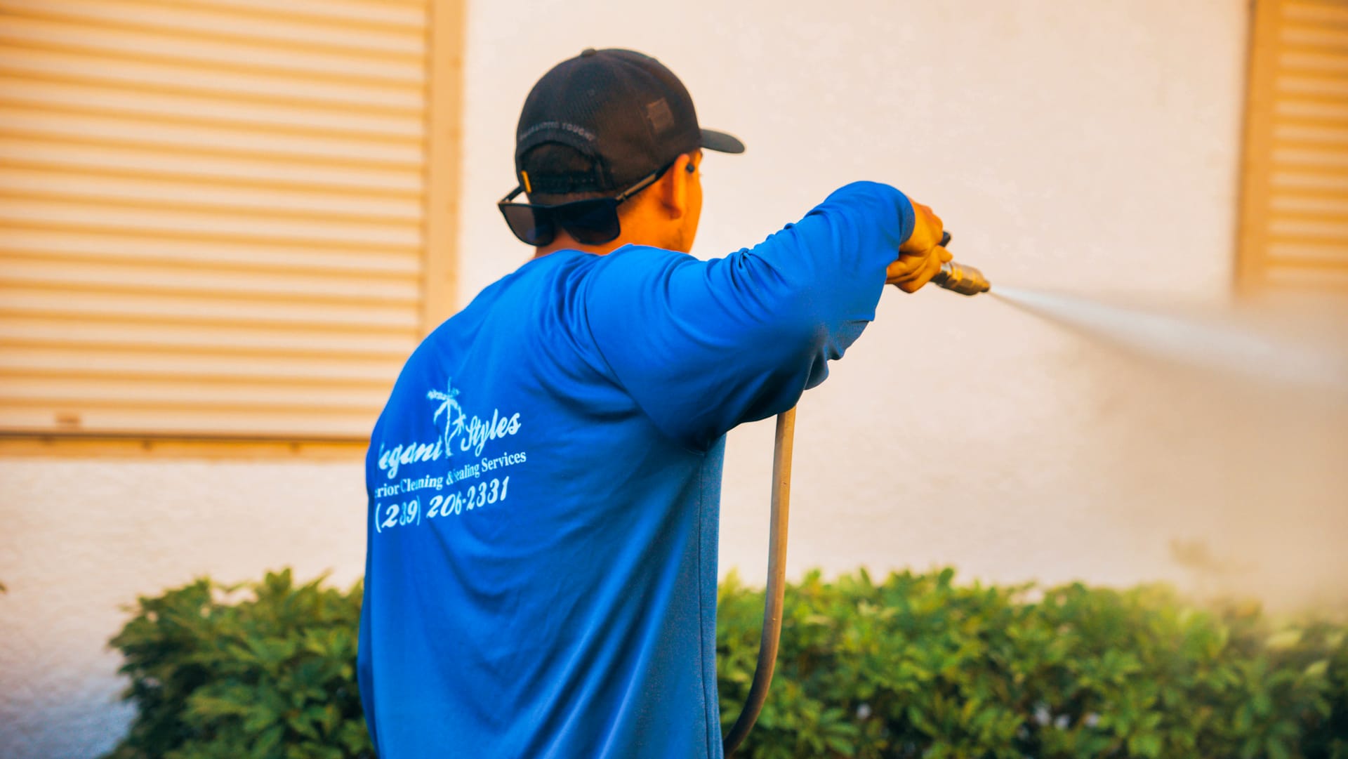 Commercial property in Naples, FL undergoing professional power washing by Elegant Styles Power Wash to enhance curb appeal