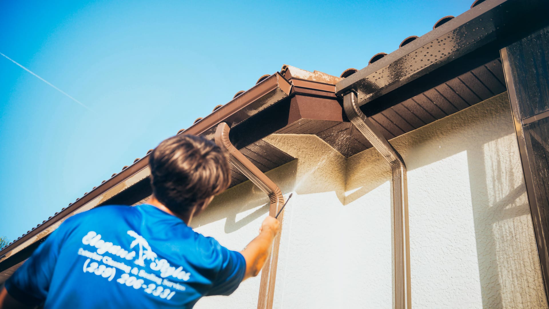 Professional gutter cleaning service in Southwest Florida, removing debris to prevent overflow and water damage.