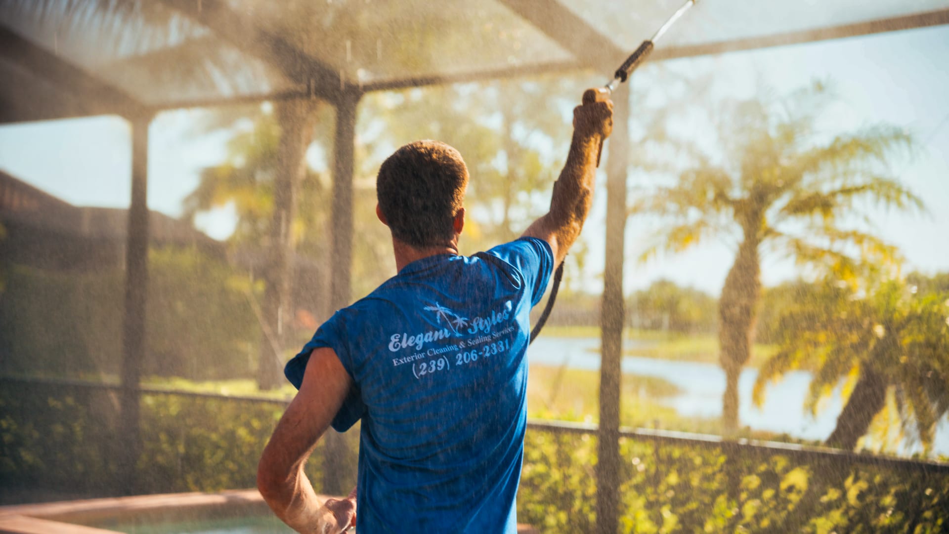 Elegant Styles Power Washing team cleaning a large multi-story home in Naples, FL, ensuring every surface is pristine and well-maintained.