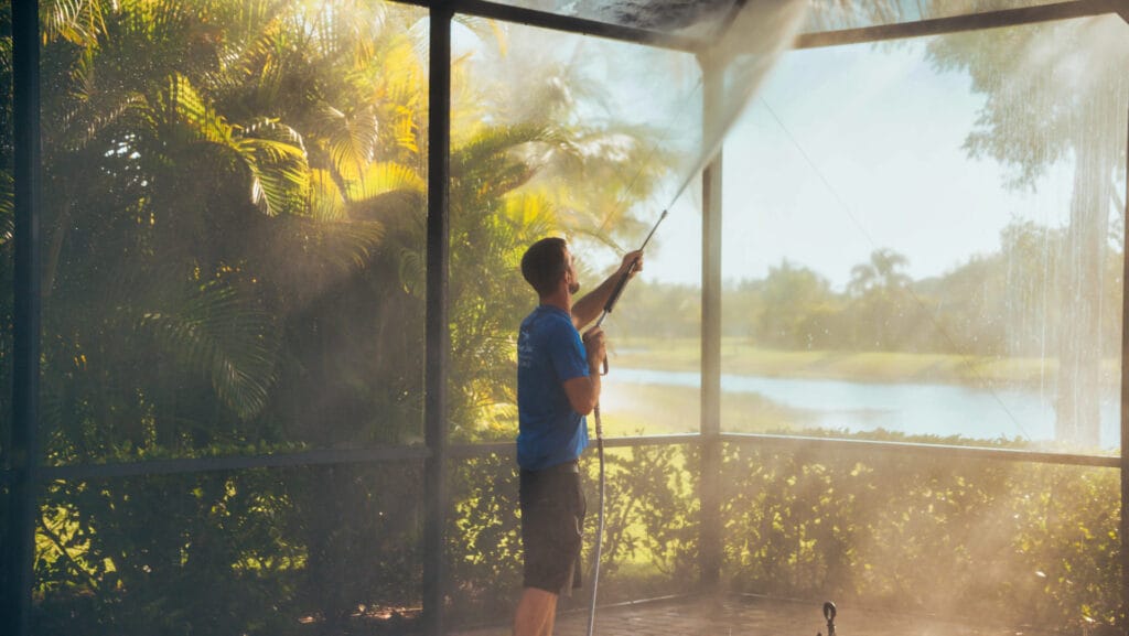 Professional pool cage cleaning by Elegant Styles Power Wash in Naples, Florida, removing mold and algae buildup
