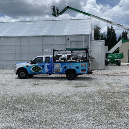 Commercial property in Naples, FL undergoing professional power washing by Elegant Styles Power Wash to enhance curb appeal