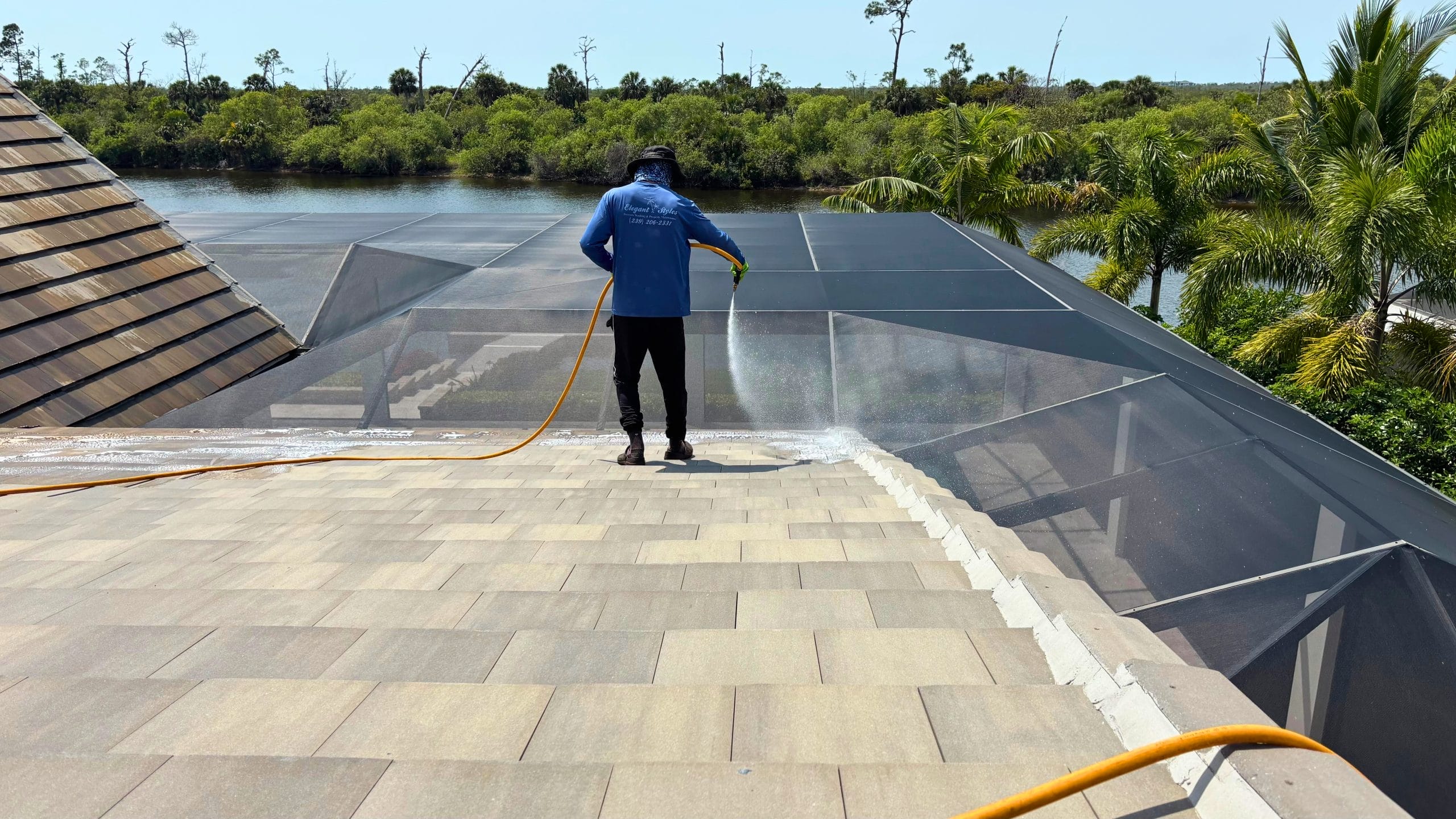 Professional roof cleaning in Naples FL by Elegant Styles Power Washing to prevent costly repairs and improve energy efficiency.