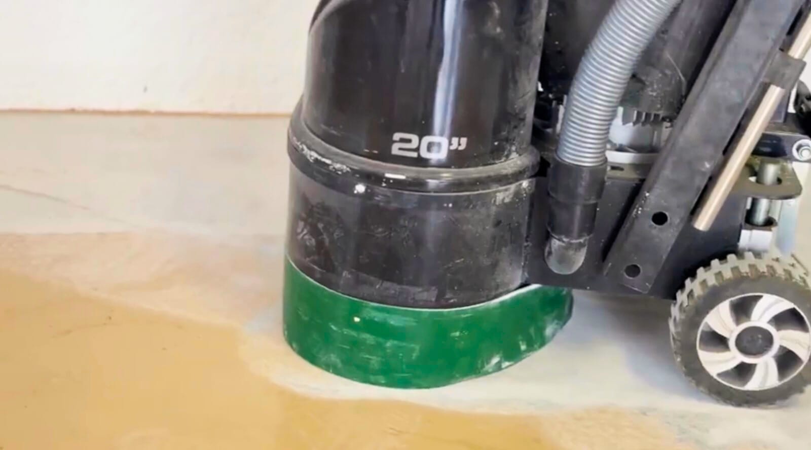 Clean, modern garage with high-gloss epoxy flooring professionally installed to create a sleek, durable, and chemical-resistant surface.